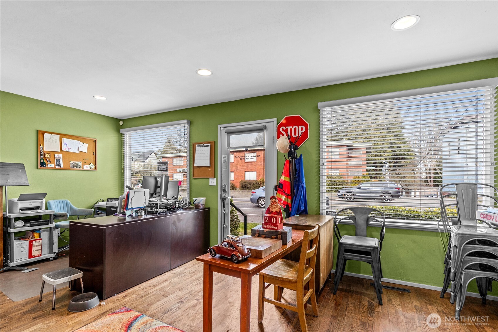 4431 Southwest Admiral Way Seattle, WA 98116 - Photo 3 of 25 a view of a workspace with furniture and a window