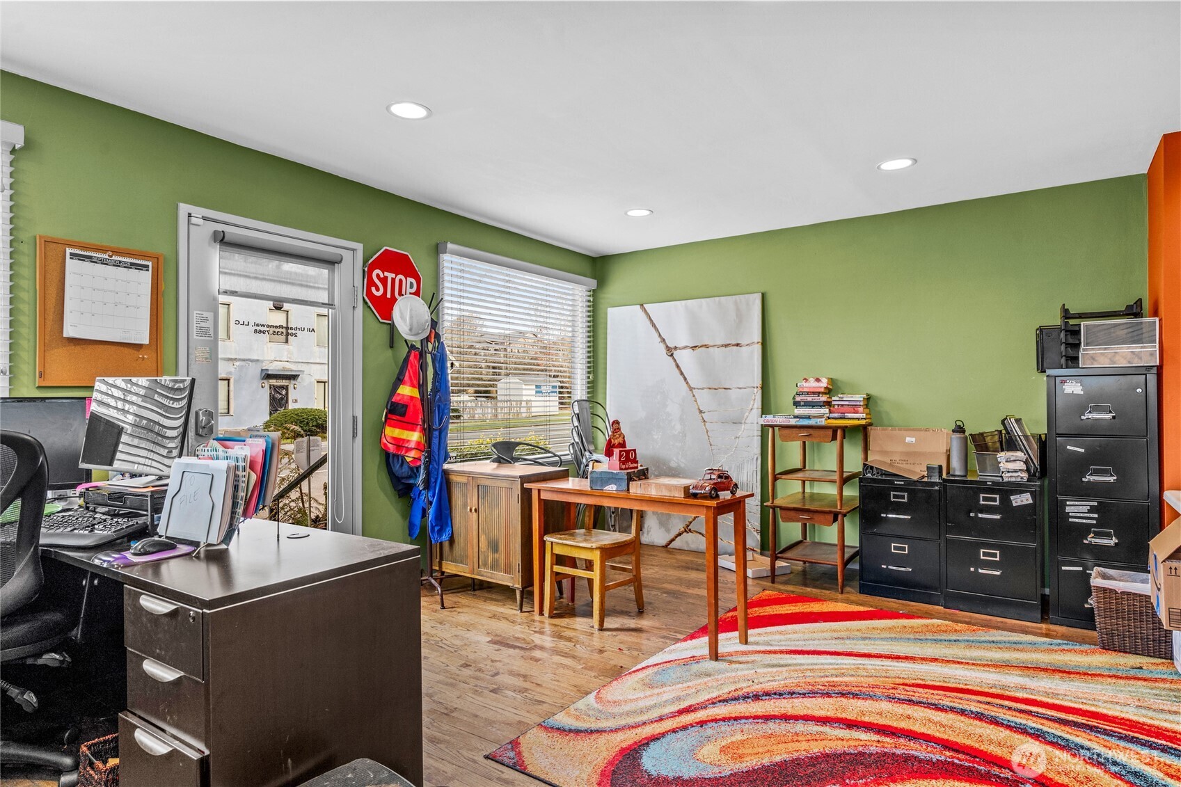 4431 Southwest Admiral Way Seattle, WA 98116 - Photo 5 of 25 a living room with furniture and a flat screen tv