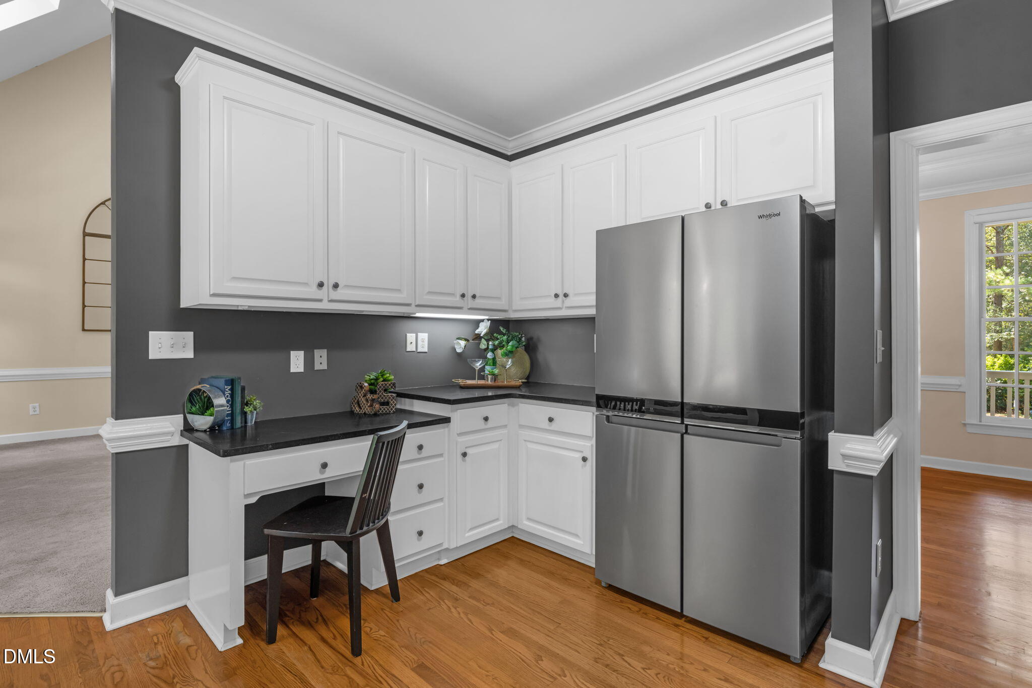 5309 Shoreline Court Holly Springs, NC 27540 - Photo 13 of 46 a kitchen with stainless steel appliances a refrigerator sink and cabinets