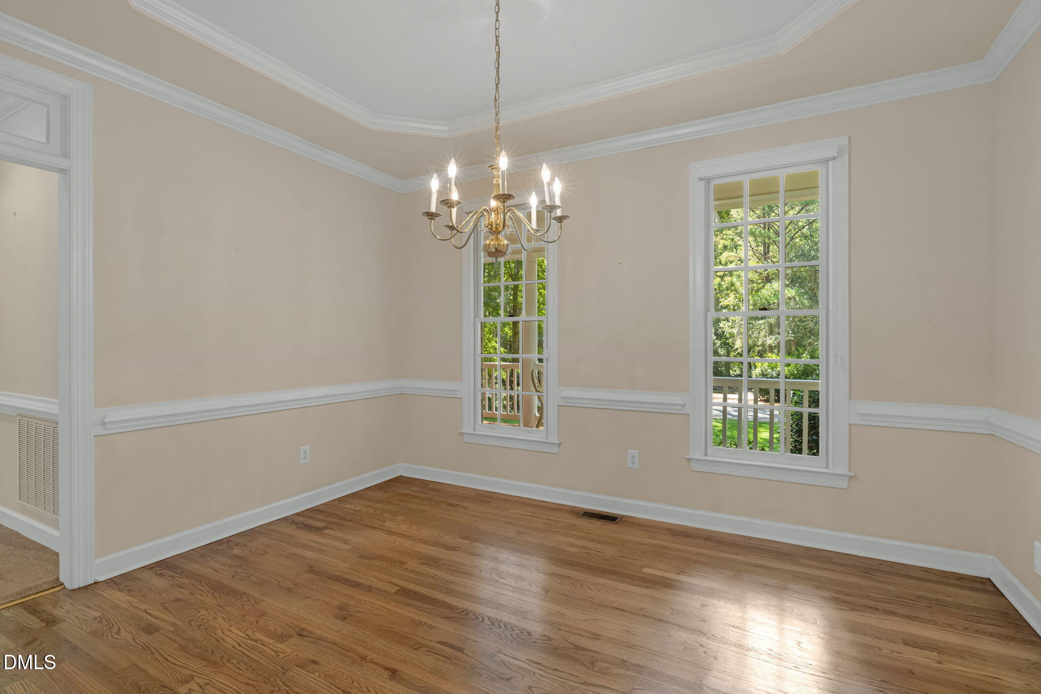 5309 Shoreline Court Holly Springs, NC 27540 - Photo 16 of 46 a view of livingroom with window and hardwood floor
