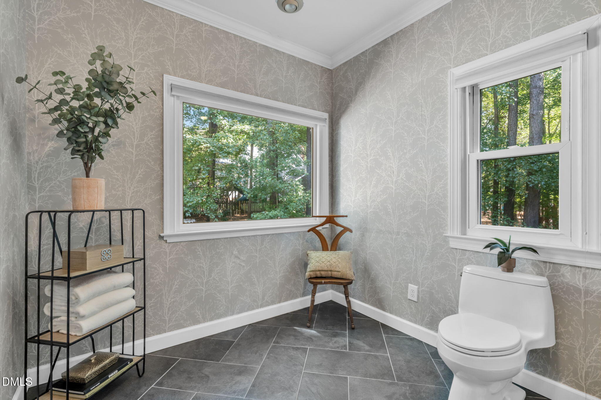 5309 Shoreline Court Holly Springs, NC 27540 - Photo 21 of 46 a bathroom with a toilet sink and mirror