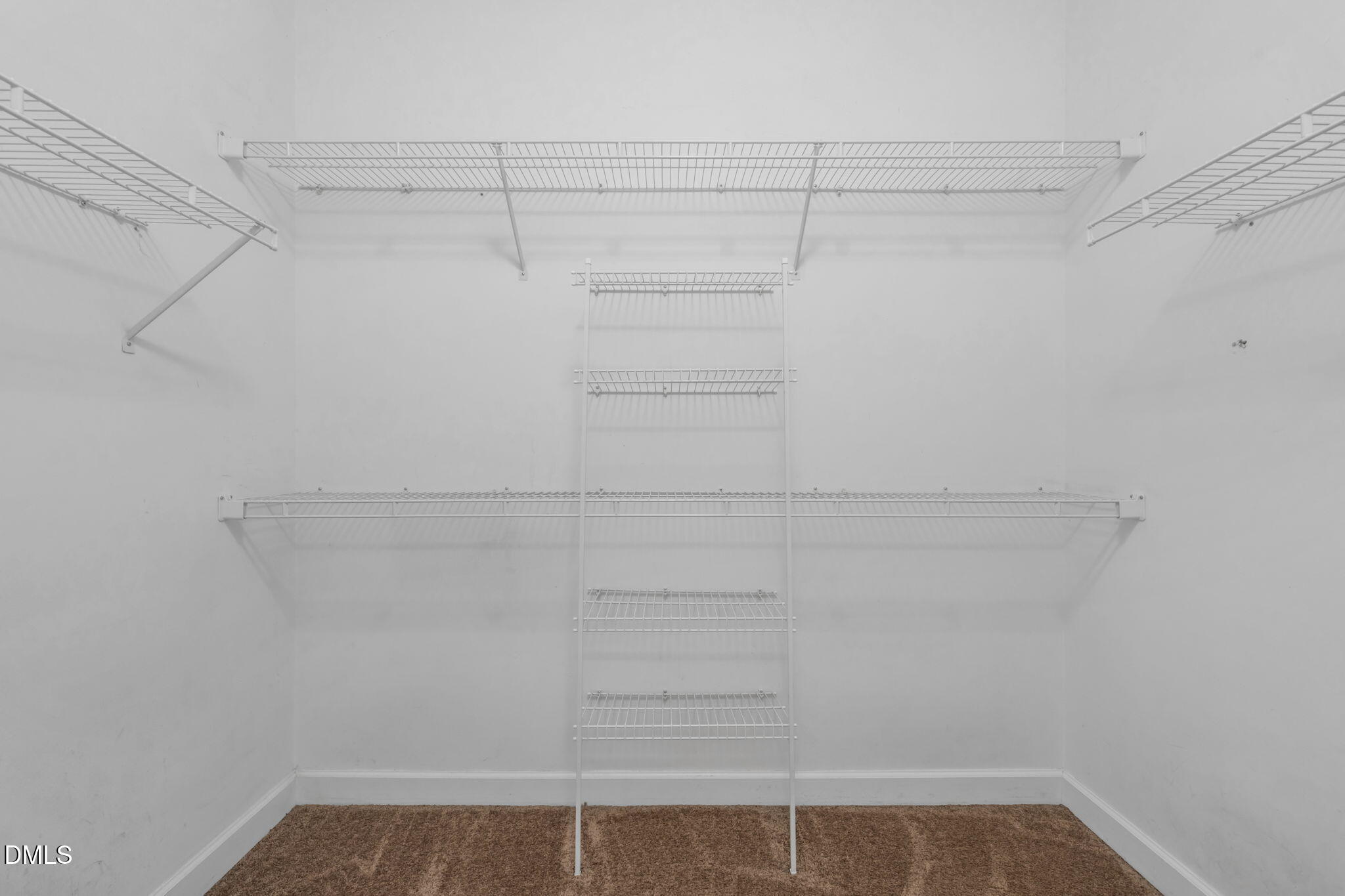 5309 Shoreline Court Holly Springs, NC 27540 - Photo 23 of 46 a view of a room with racks on the wall