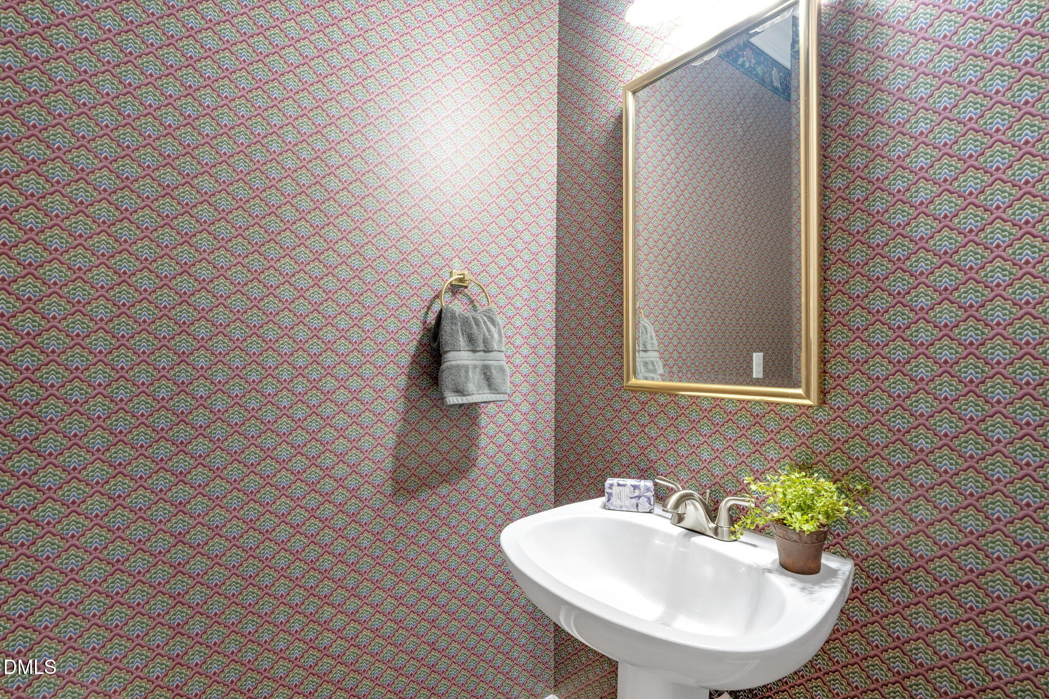 5309 Shoreline Court Holly Springs, NC 27540 - Photo 25 of 46 a bathroom with a sink and a mirror