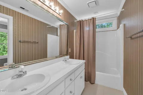a bathroom with a bathtub and a sink