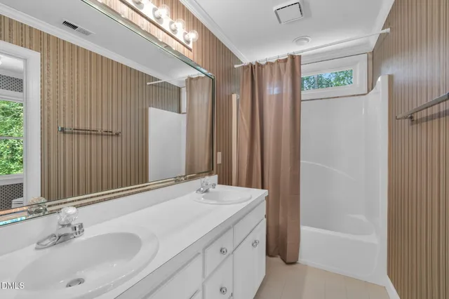 a bathroom with a bathtub and a sink
