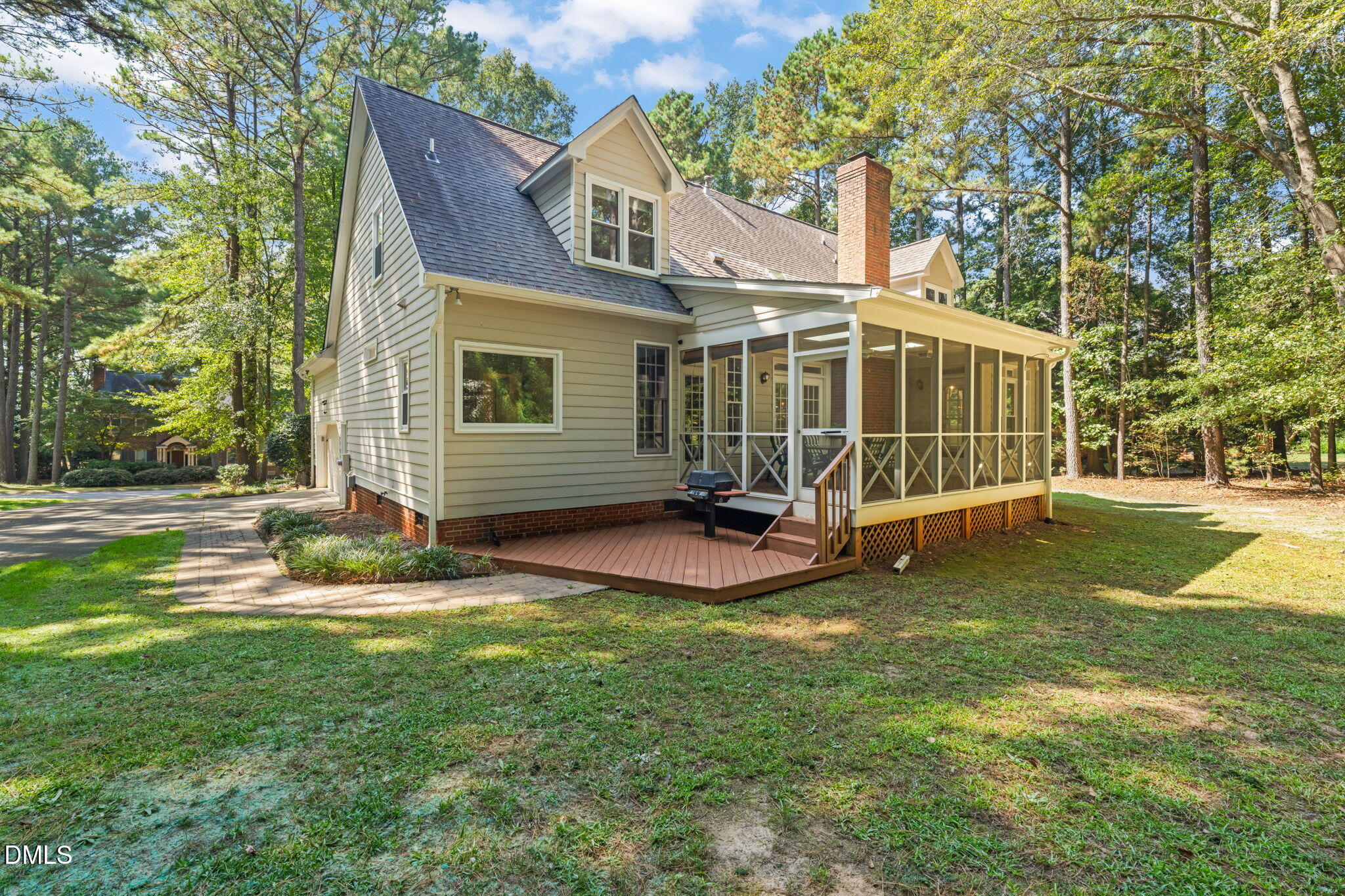 5309 Shoreline Court Holly Springs, NC 27540 - Photo 41 of 46 a view of a house with backyard and a tree