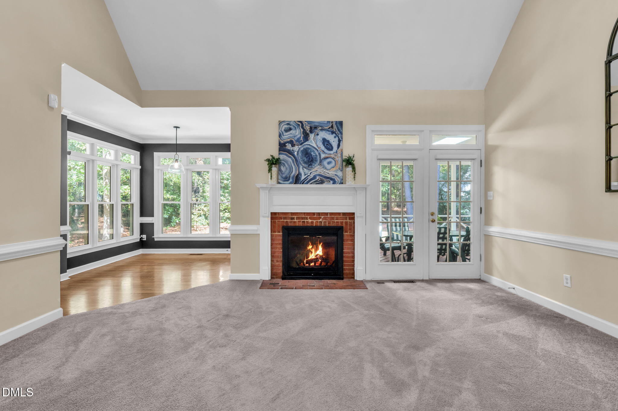5309 Shoreline Court Holly Springs, NC 27540 - Photo 5 of 46 a view of an empty room with a fireplace and a window