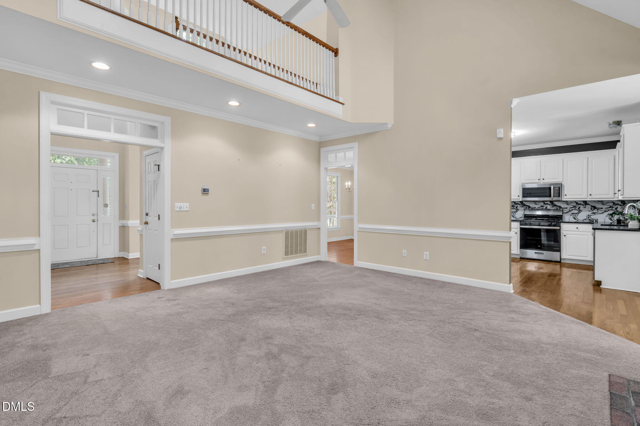 5309 Shoreline Court Holly Springs, NC 27540 - Photo 8 of 46 an empty room with wooden floor and windows