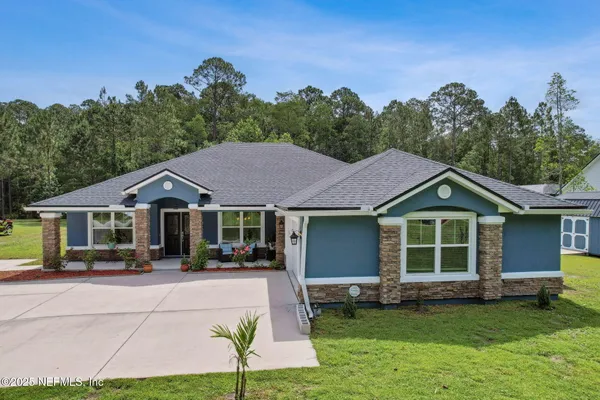 a front view of a house with a yard