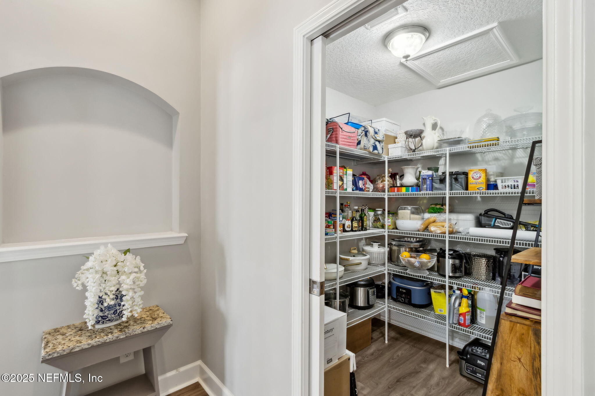 75652 Edwards Road Yulee, FL 32097 - Photo 10 of 26 a room with lots of books and a book shelf