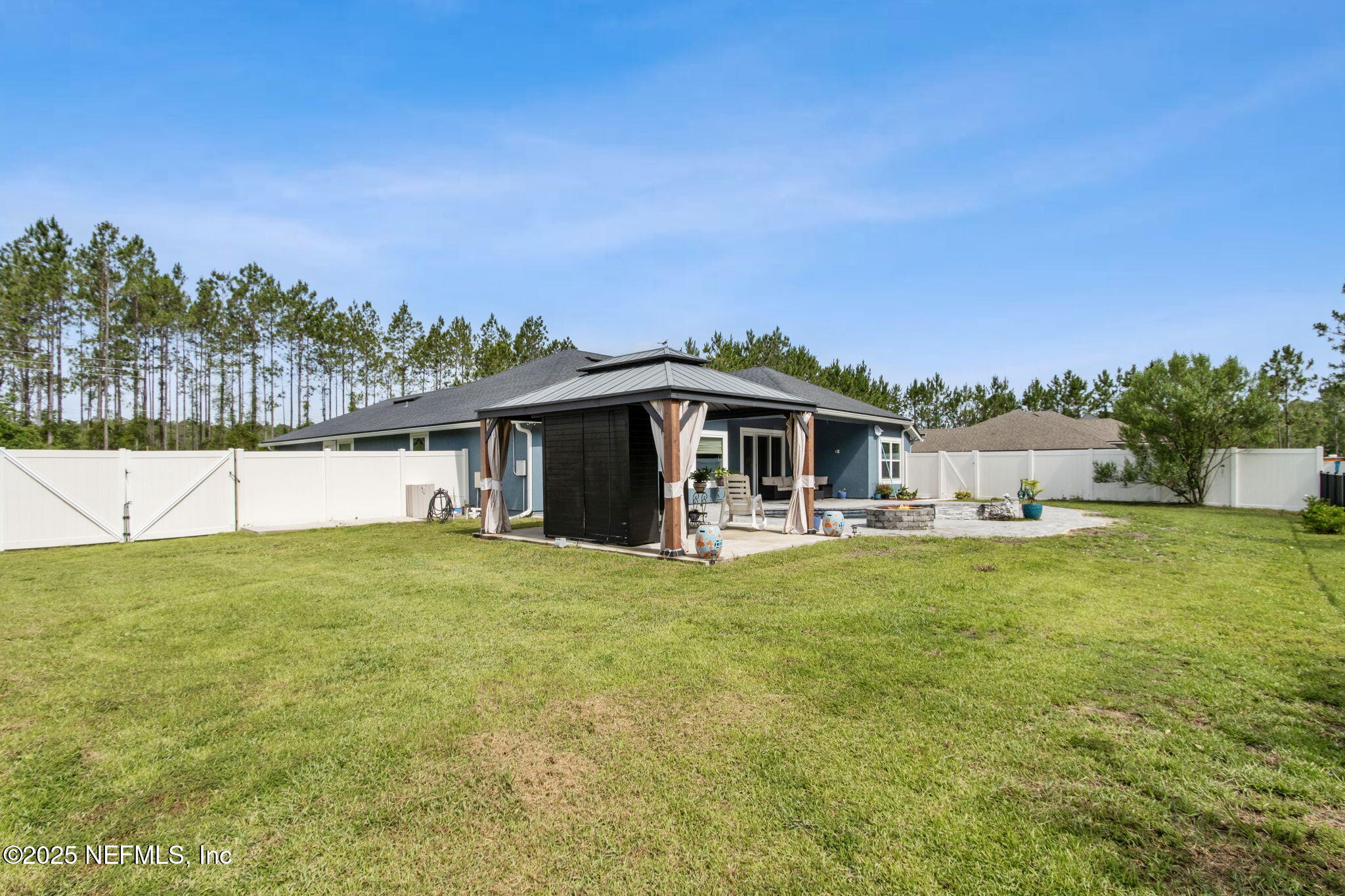 75652 Edwards Road Yulee, FL 32097 - Photo 20 of 26 a front view of house with yard and trees