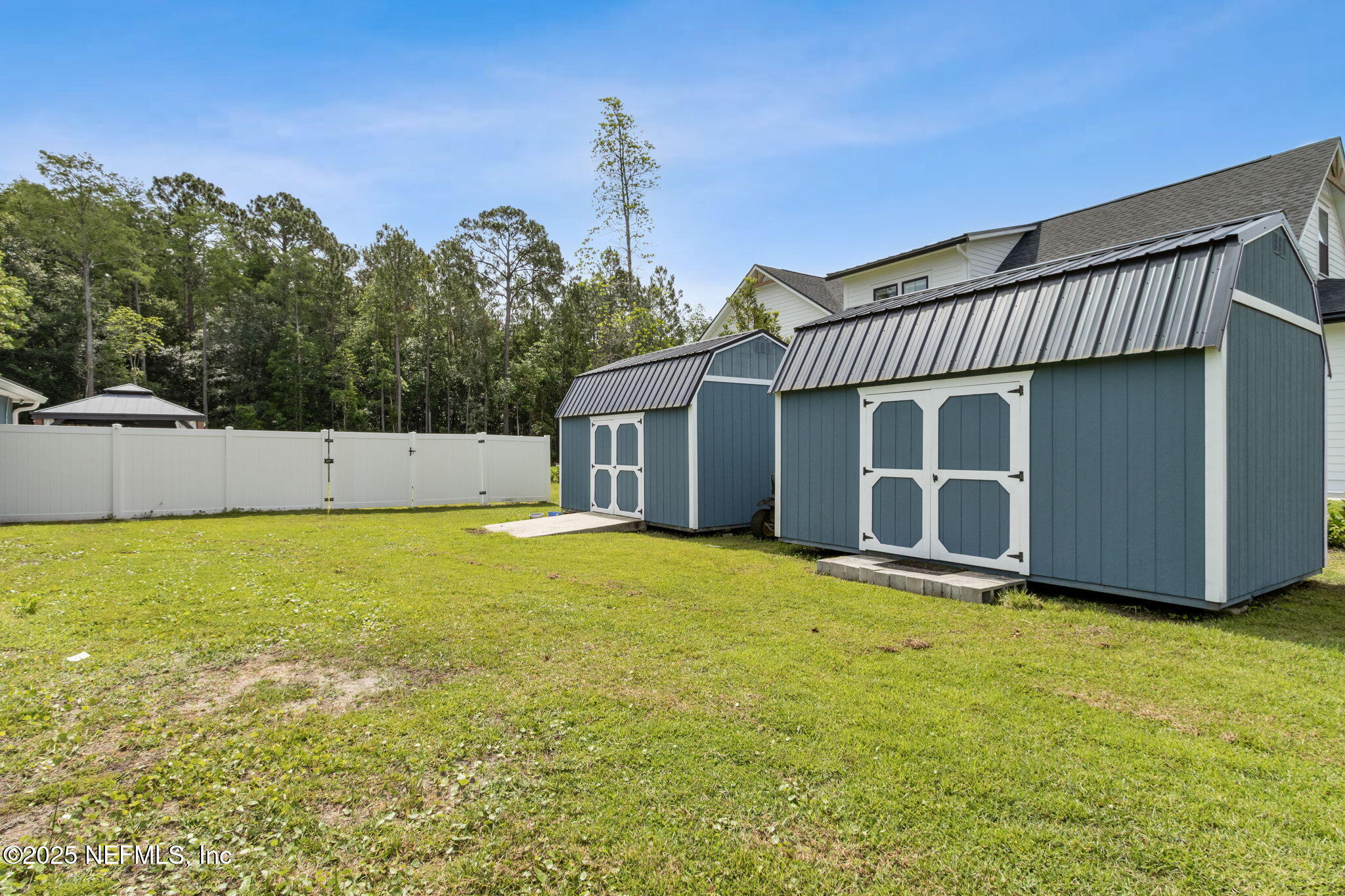75652 Edwards Road Yulee, FL 32097 - Photo 24 of 26 a view of a house with a yard