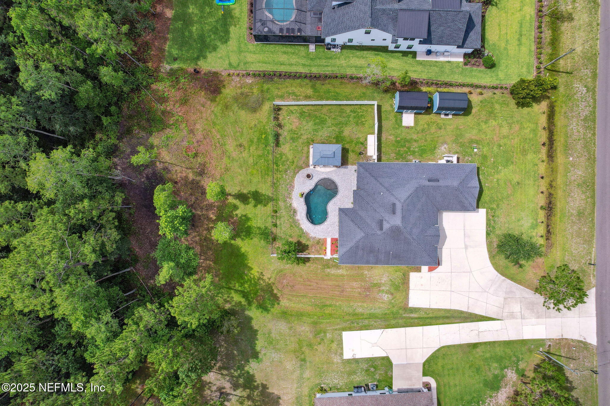 75652 Edwards Road Yulee, FL 32097 - Photo 25 of 26 an aerial view of a house with outdoor space pool seating area and yard
