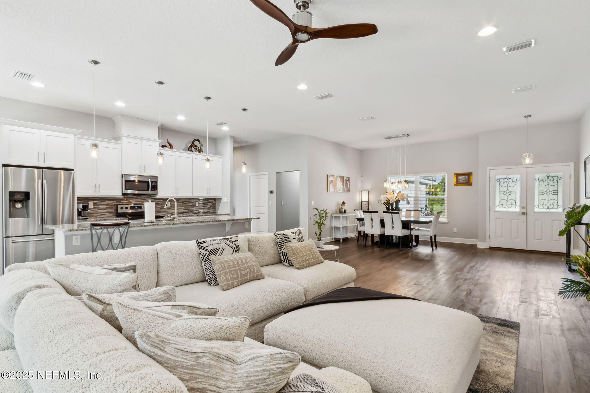 75652 Edwards Road Yulee, FL 32097 - Photo 7 of 26 a living room with furniture and kitchen view