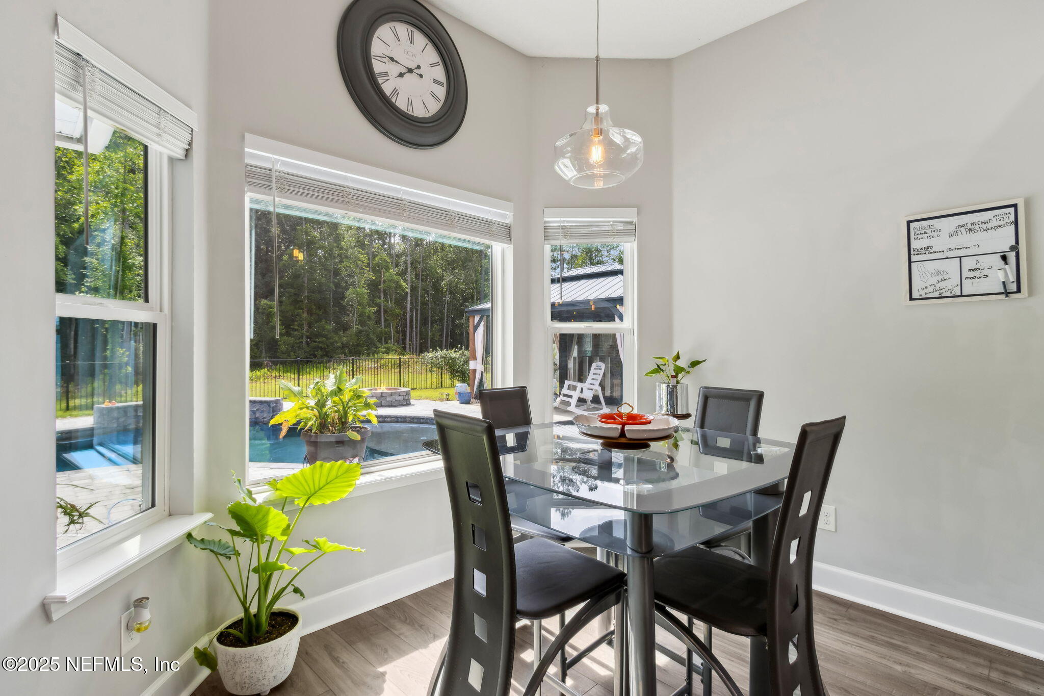 75652 Edwards Road Yulee, FL 32097 - Photo 9 of 26 a view of a dining room with furniture window and wooden floor