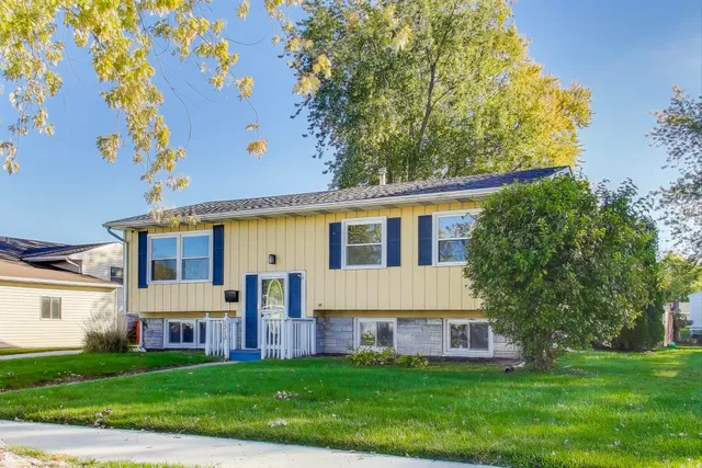 front view of a house with a yard