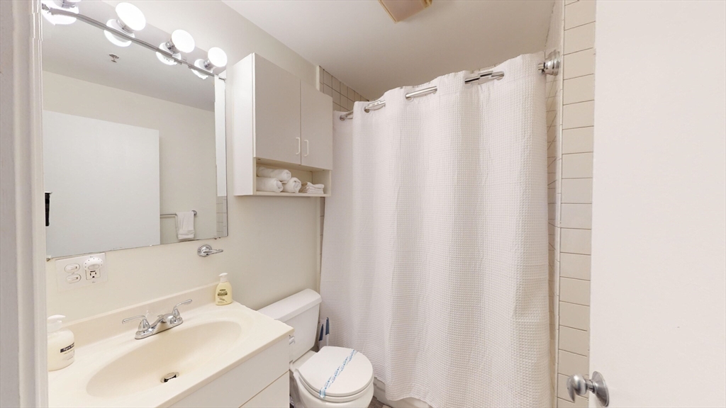19 Stanhope Street, Unit 1D Boston, MA 02116 - Photo 12 of 26 a bathroom with a sink toilet and shower