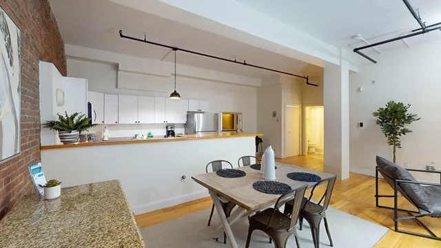 a kitchen with a table and chairs in it