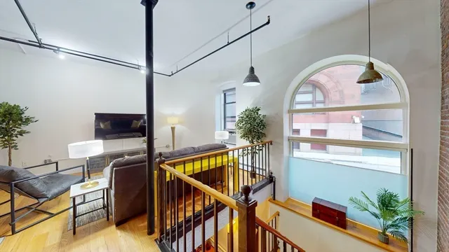 a view of room with window and wooden floor