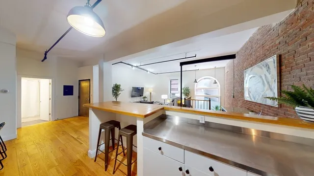 a view of a living room and bathroom