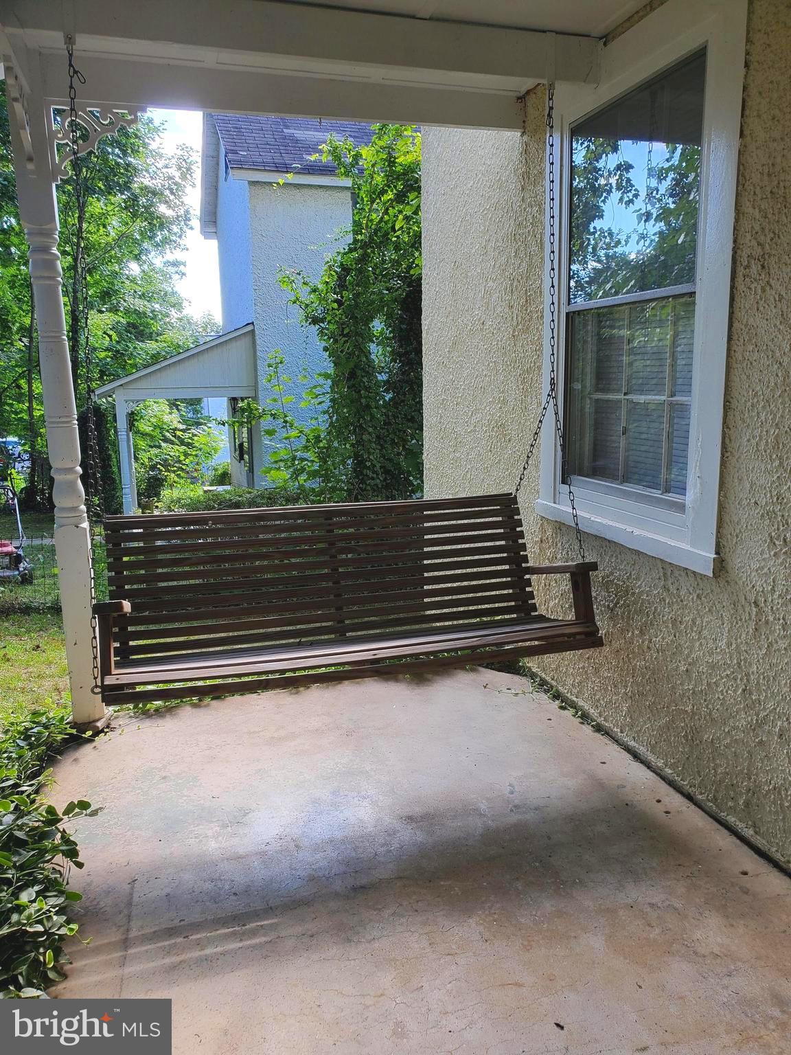 a view of bench in front of house