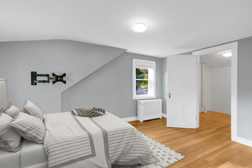 7 Longworth Road Worcester, MA 01602 - Photo 17 of 20 a bedroom with a bed and a window