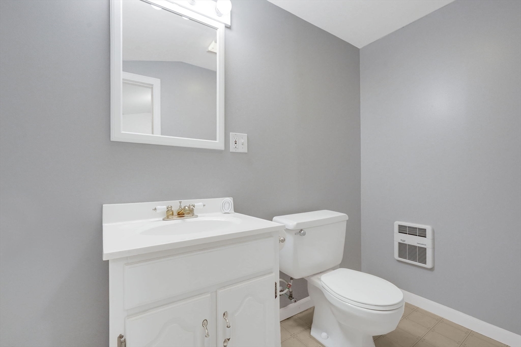 7 Longworth Road Worcester, MA 01602 - Photo 18 of 20 a white toilet sitting next to a bathroom sink