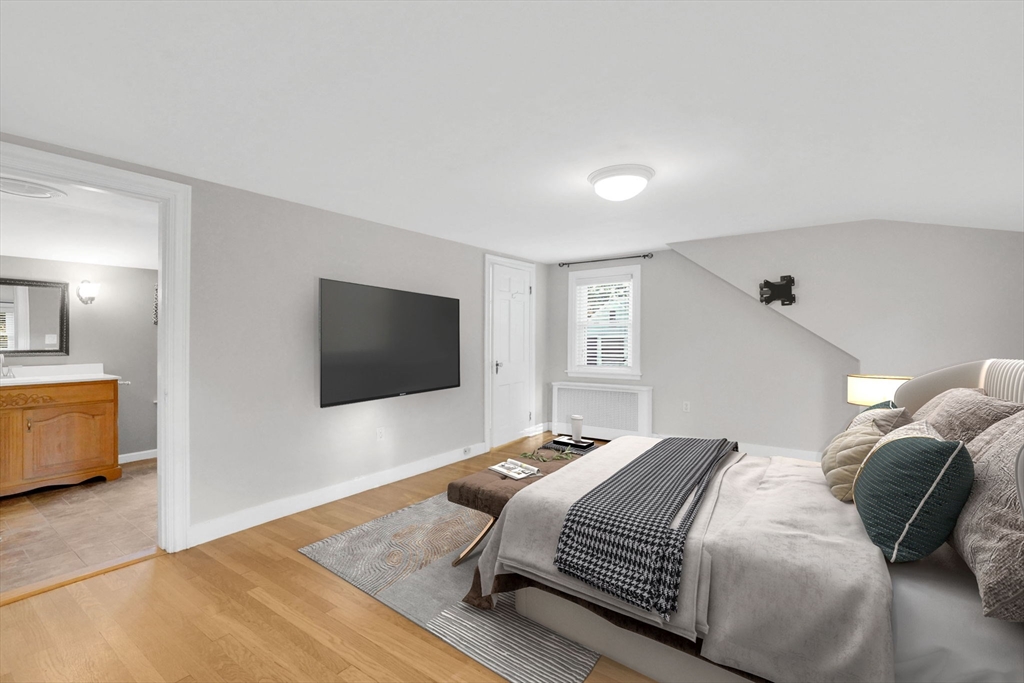 7 Longworth Road Worcester, MA 01602 - Photo 8 of 20 a bedroom with a bed and a flat screen tv