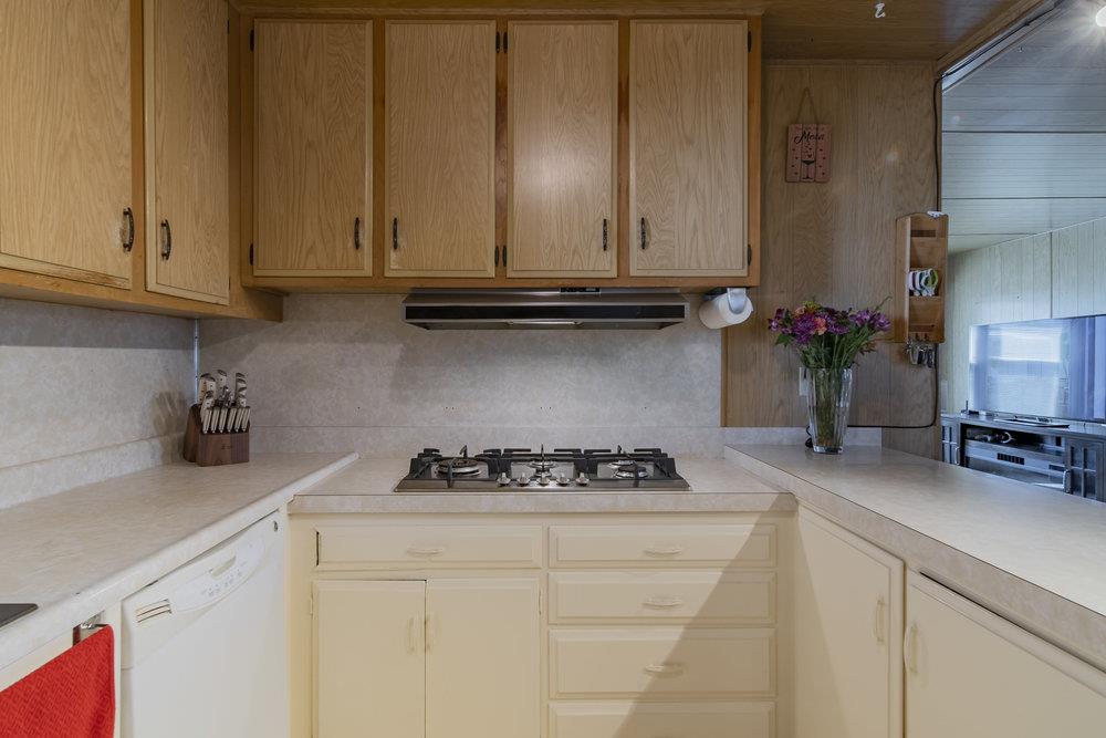 4300 Soquel Drive, Unit 220 Soquel, CA 95073 - Photo 11 of 24 a kitchen with a stove and cabinets