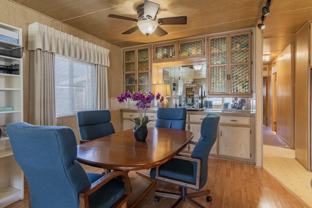 4300 Soquel Drive, Unit 220 Soquel, CA 95073 - Photo 12 of 24 a view of a dining room with furniture window and wooden floor