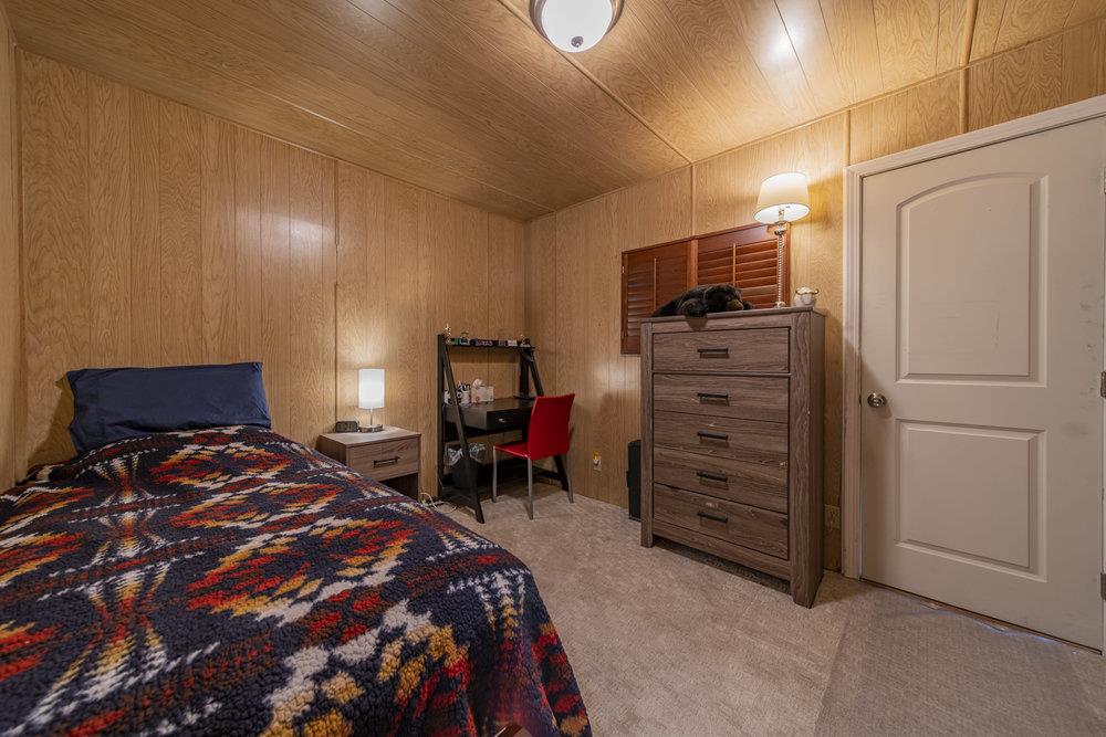 4300 Soquel Drive, Unit 220 Soquel, CA 95073 - Photo 15 of 24 a bedroom with a bed and furniture