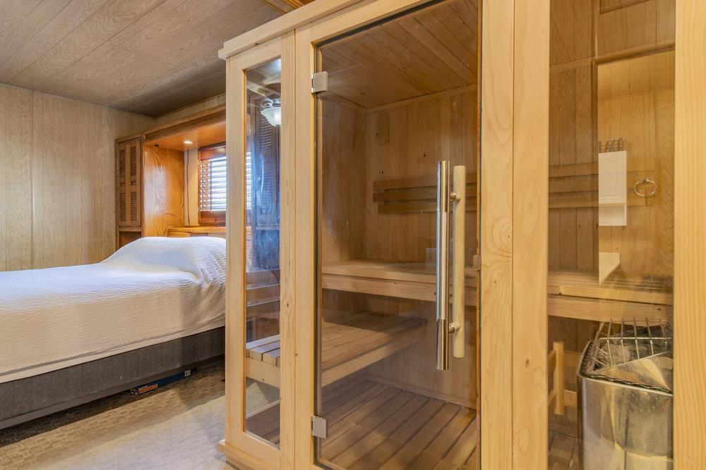 4300 Soquel Drive, Unit 220 Soquel, CA 95073 - Photo 17 of 24 a bedroom with a bed and a glass door shower