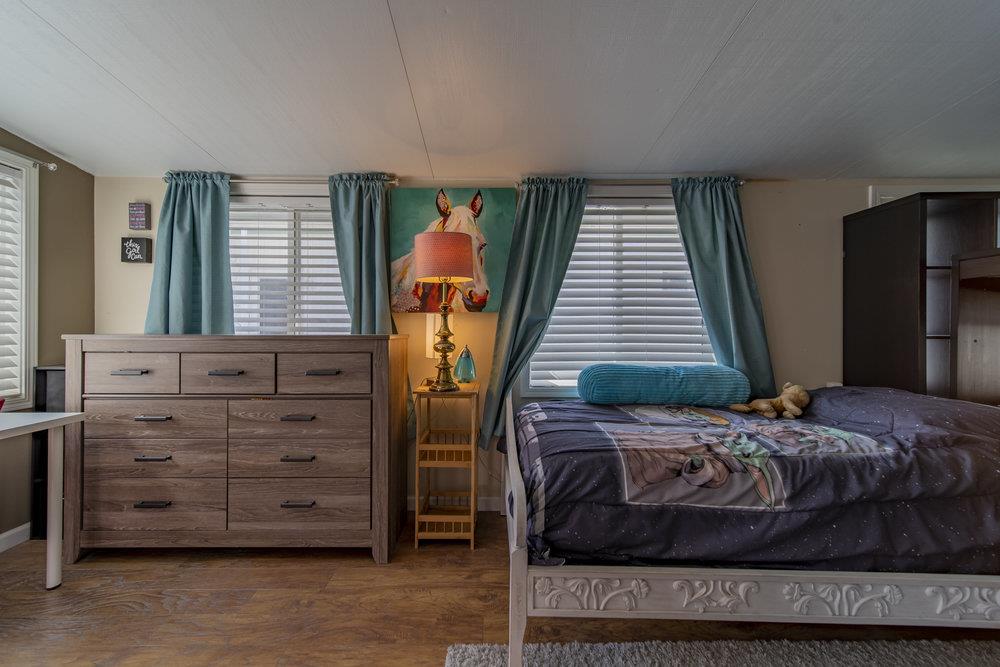 4300 Soquel Drive, Unit 220 Soquel, CA 95073 - Photo 20 of 24 a bedroom with a bed and a window