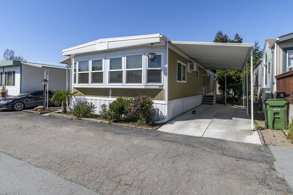 4300 Soquel Drive, Unit 220 Soquel, CA 95073 - Photo 2 of 24 a front view of a house with a yard