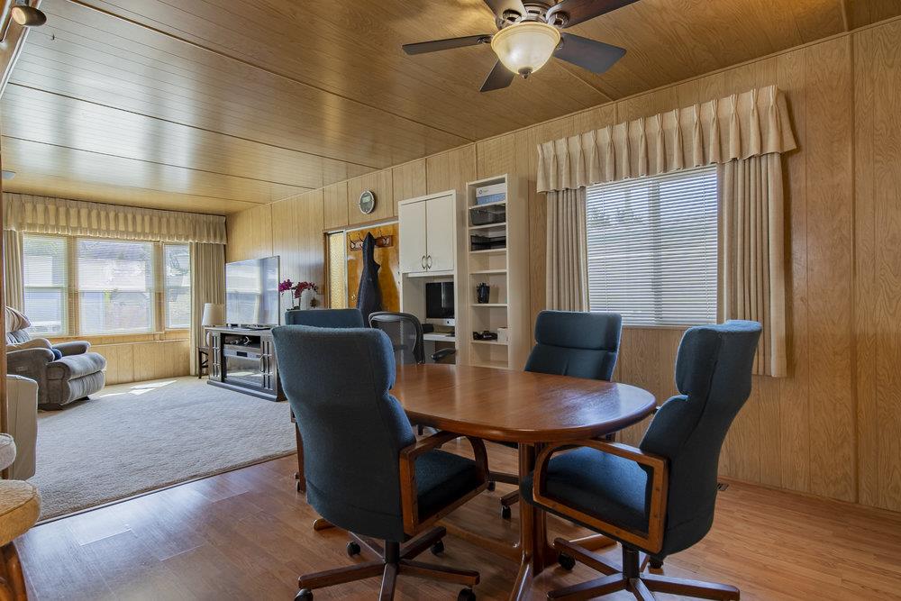4300 Soquel Drive, Unit 220 Soquel, CA 95073 - Photo 9 of 24 a view of a dining room with furniture window and wooden floor