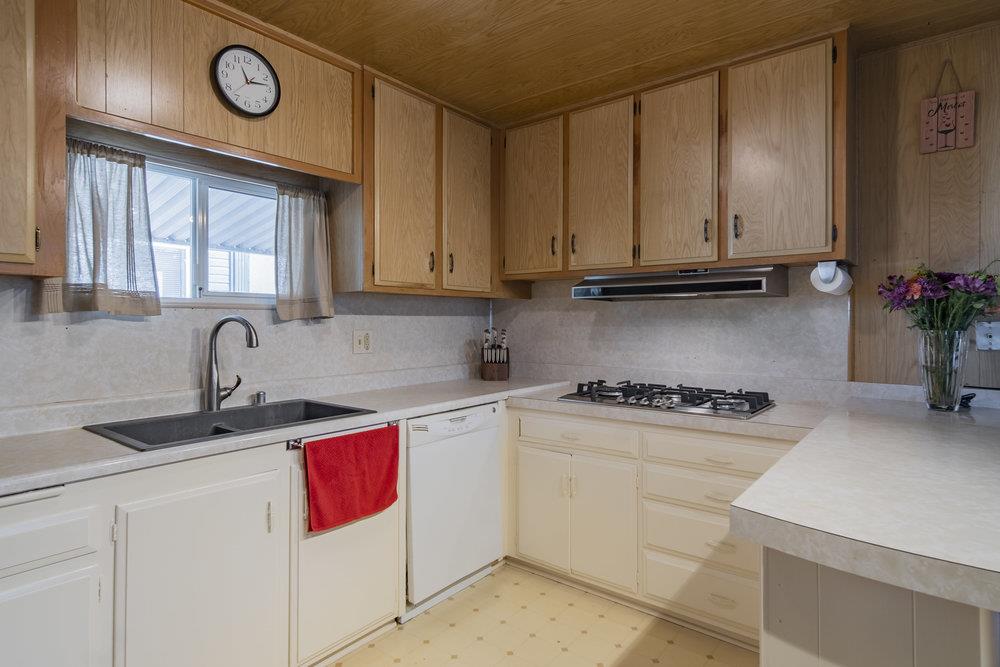 4300 Soquel Drive, Unit 220 Soquel, CA 95073 - Photo 10 of 24 a kitchen with cabinets appliances and a sink