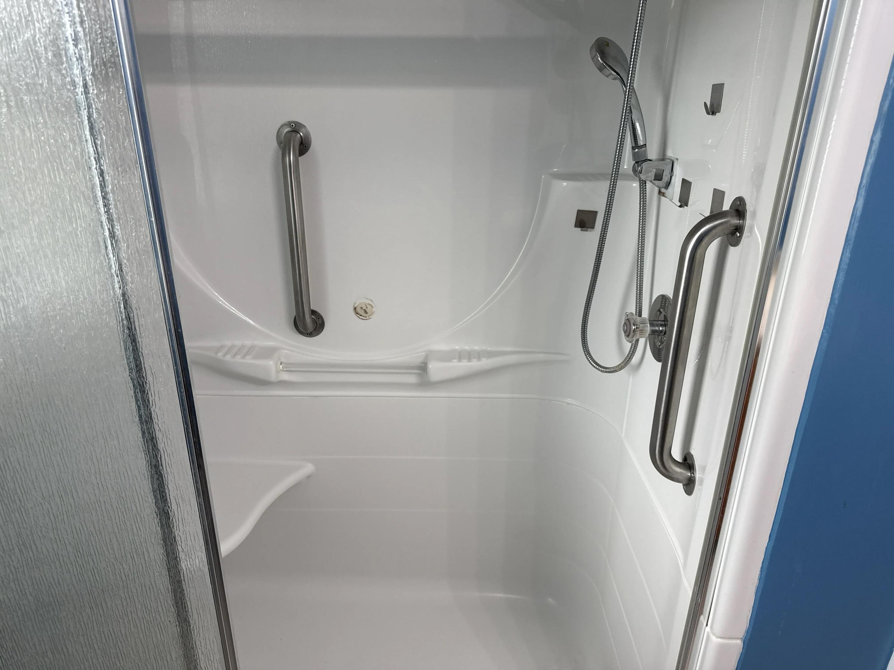 3800 Lasalle Street Racine, WI 53402 - Photo 41 of 74 Ceramic tile floor and handicap accessible shower with grab bars