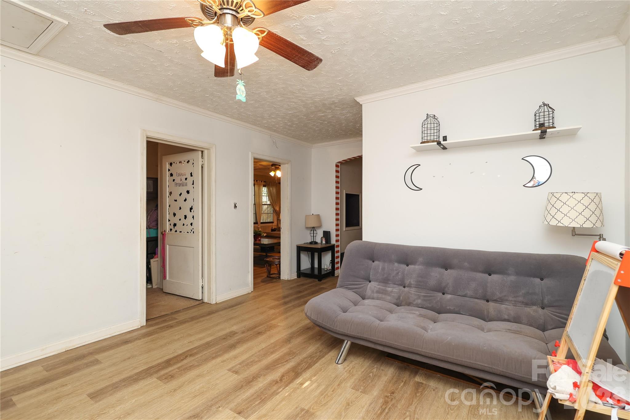 1324 State Rd S-29-496 Lancaster, SC 29720 - Photo 19 of 28 a living room with furniture and a wooden floor
