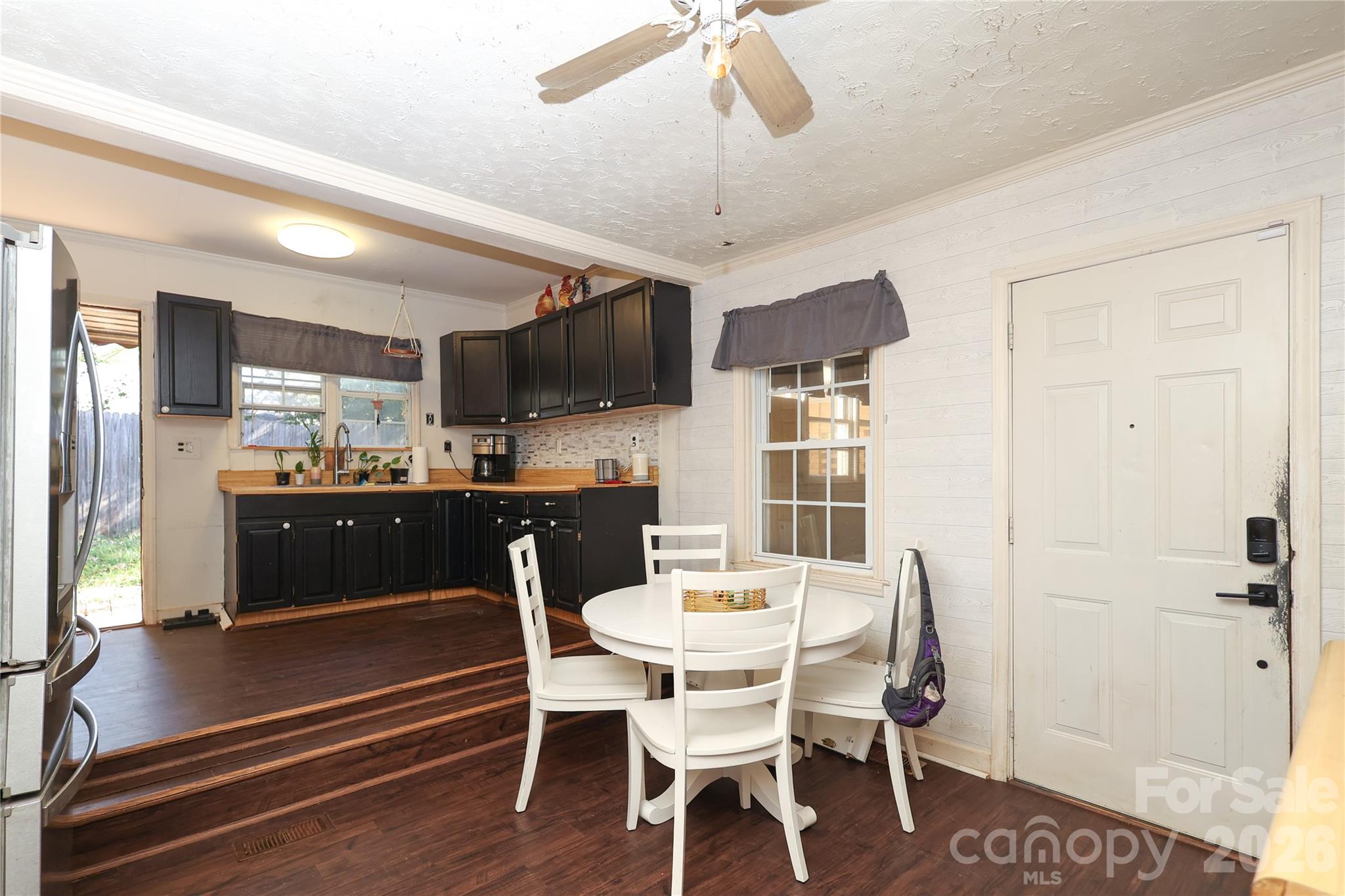 1324 State Rd S-29-496 Lancaster, SC 29720 - Photo 20 of 28 a view of a dining room with furniture window and wooden floor