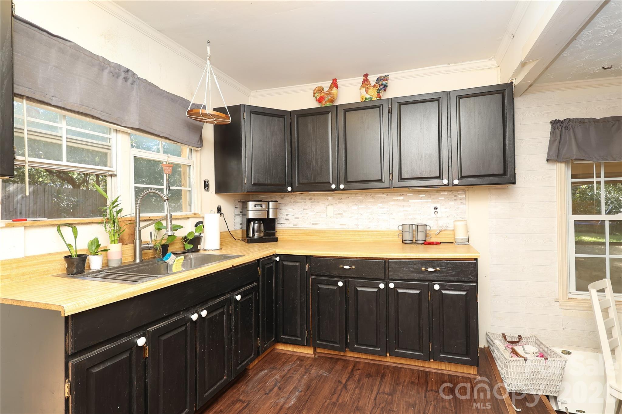 1324 State Rd S-29-496 Lancaster, SC 29720 - Photo 2 of 28 a kitchen with a sink and cabinets
