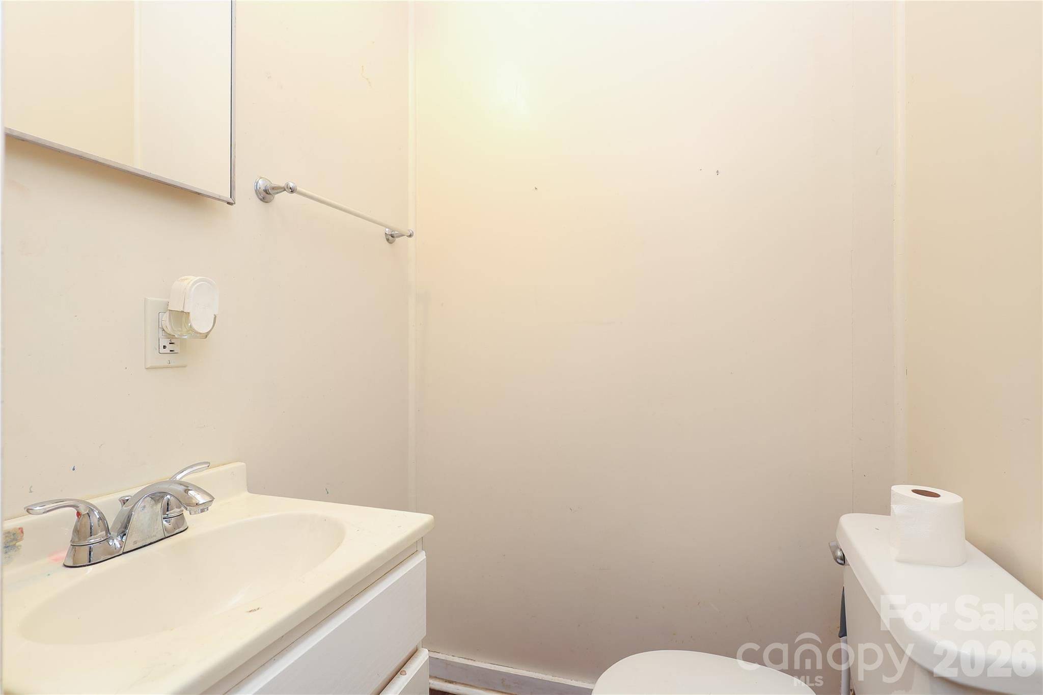 1324 State Rd S-29-496 Lancaster, SC 29720 - Photo 21 of 28 a bathroom with a sink mirror and toilet
