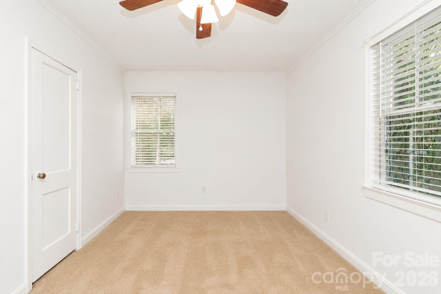 1324 State Rd S-29-496 Lancaster, SC 29720 - Photo 7 of 28 an empty room with a window and a ceiling fan
