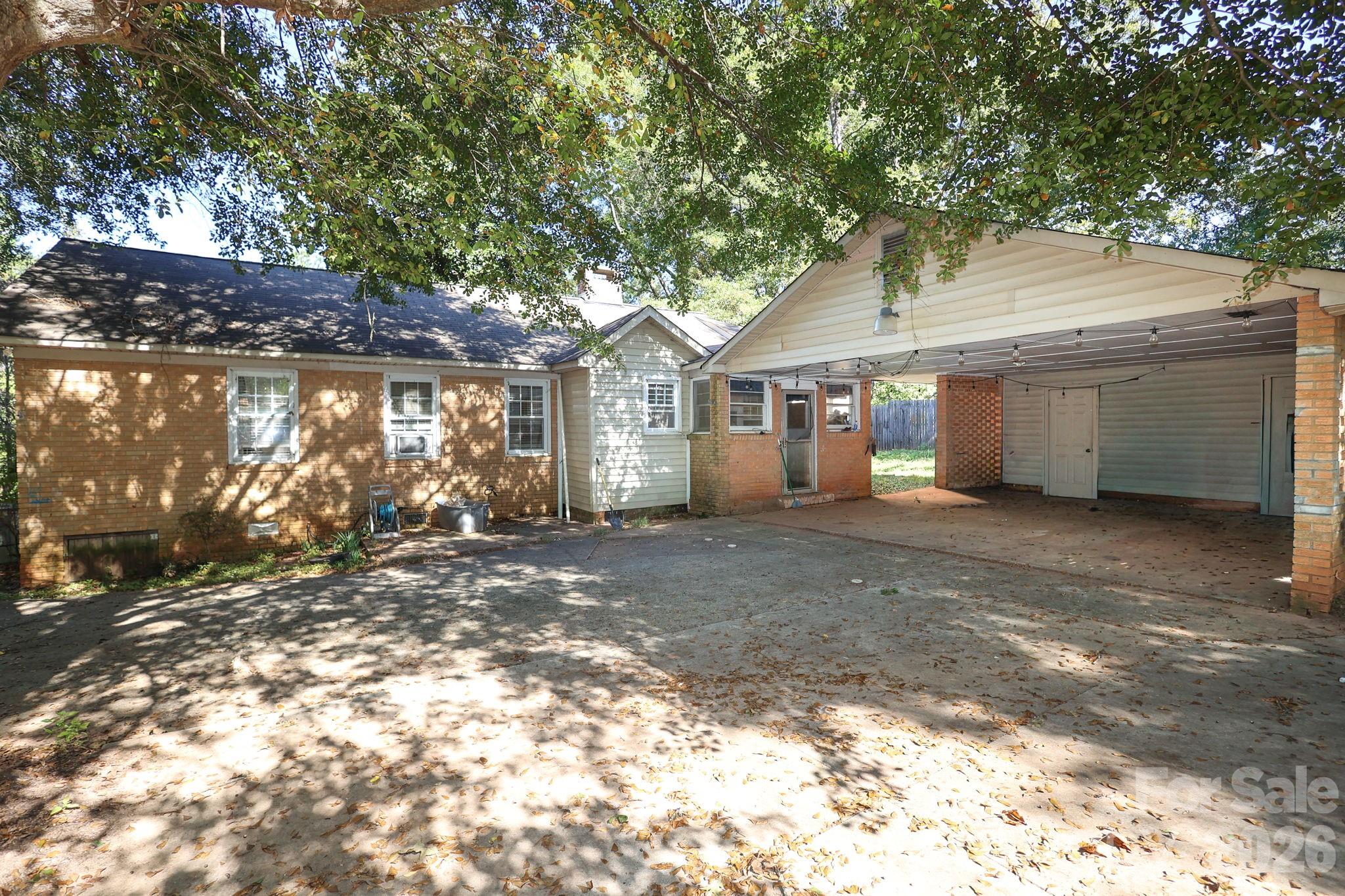 1324 State Rd S-29-496 Lancaster, SC 29720 - Photo 9 of 28 a front view of a house with a tree