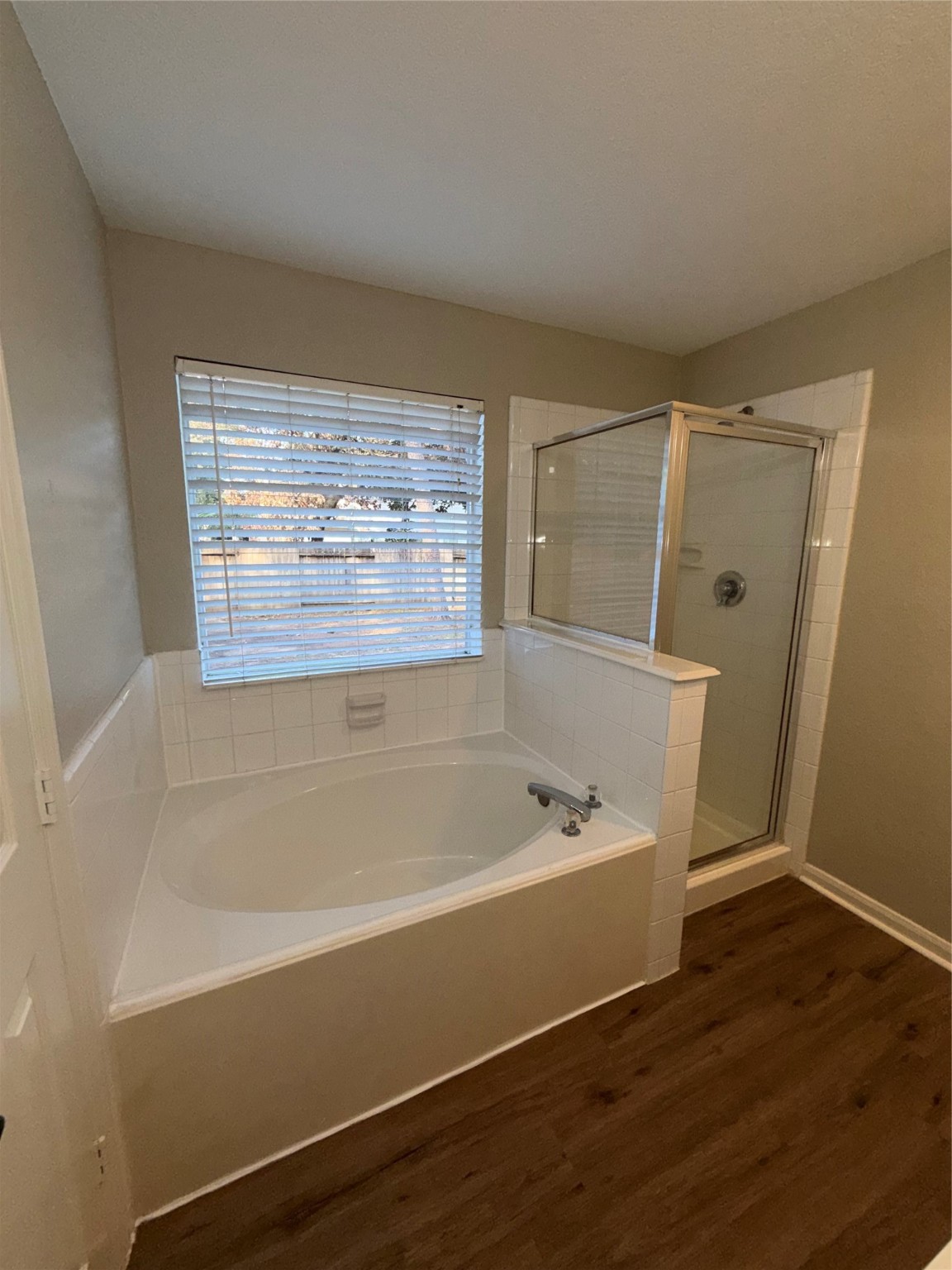 58 Shimmer Pond Place Conroe, TX 77385 - Photo 23 of 35 a bathroom with a bathtub and a shower