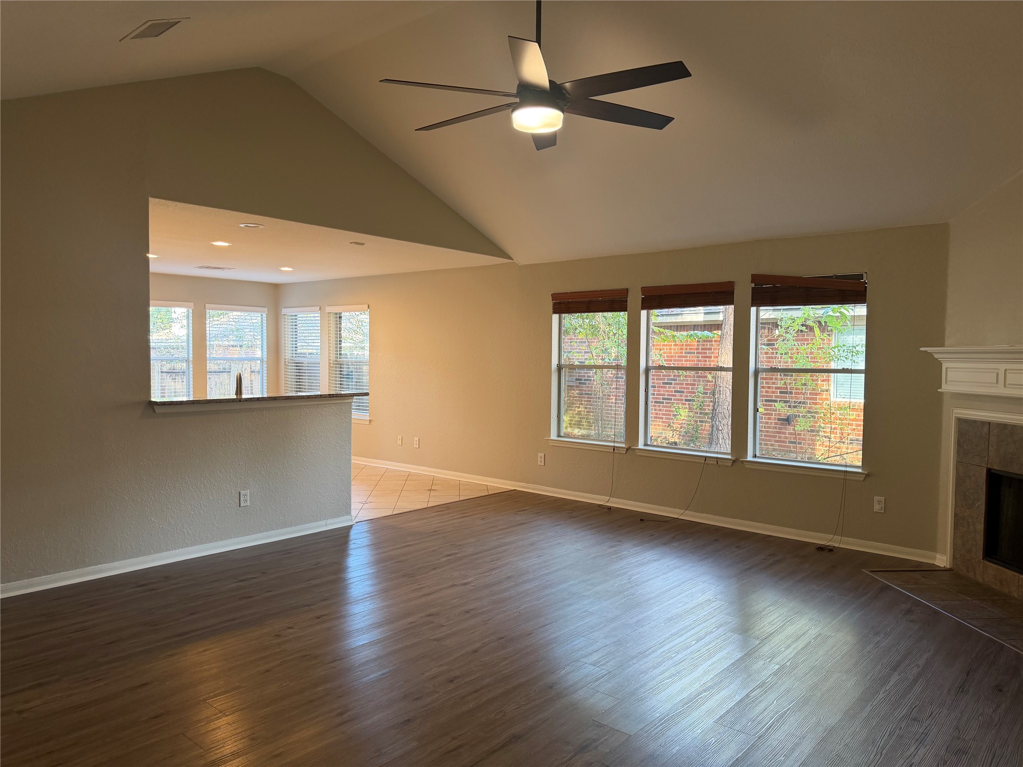 58 Shimmer Pond Place Conroe, TX 77385 - Photo 6 of 35 a view of an empty room with wooden floor and a window