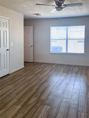 a view of kitchen and white cabinets