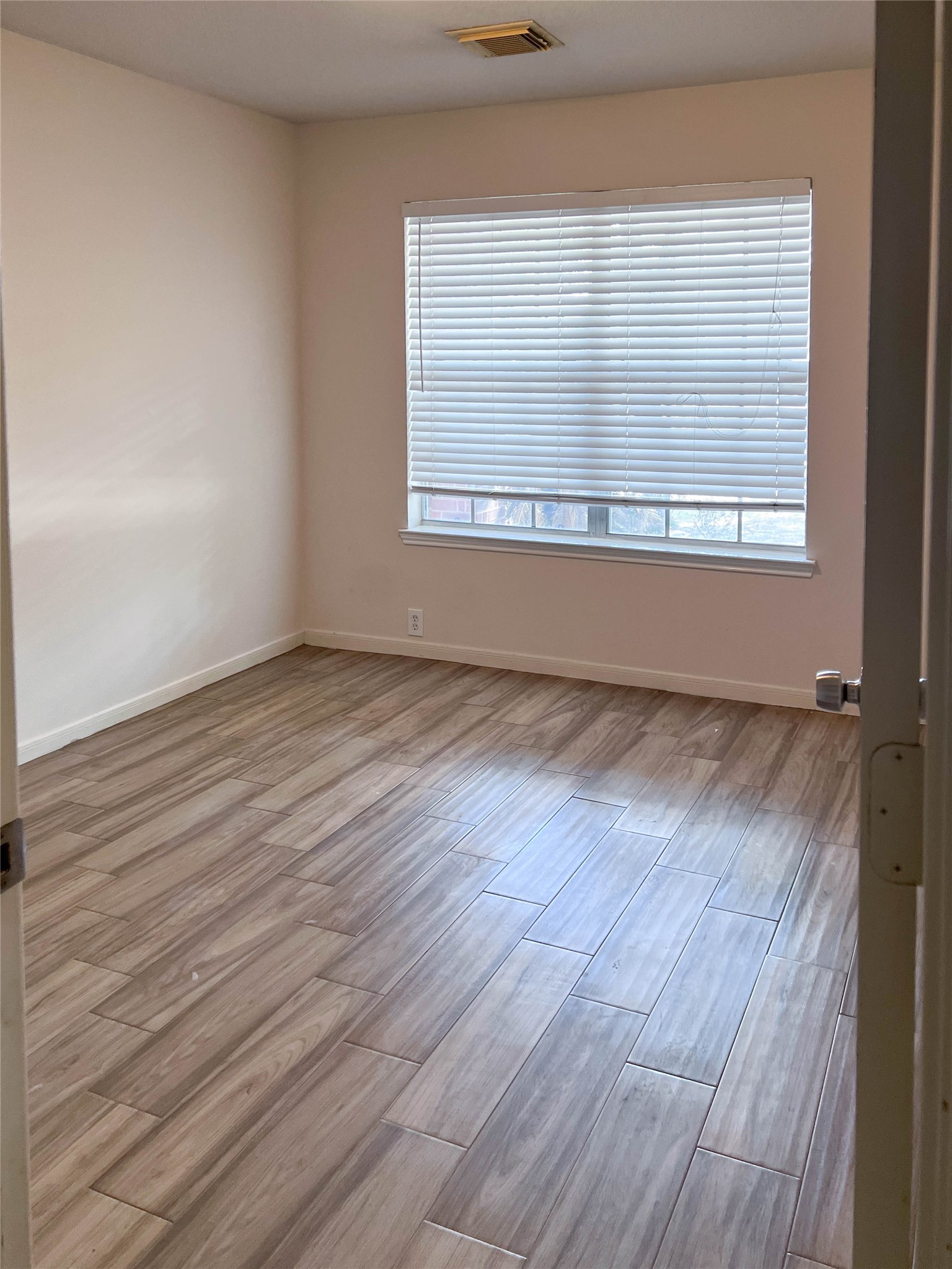 659 Cypresswood Trace Spring, TX 77373 - Photo 19 of 40 Bedroom 2 with tile and big window.