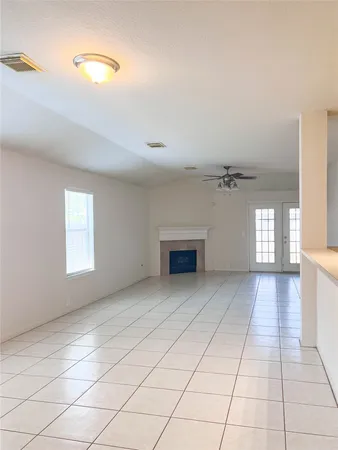 a view of an empty room and window
