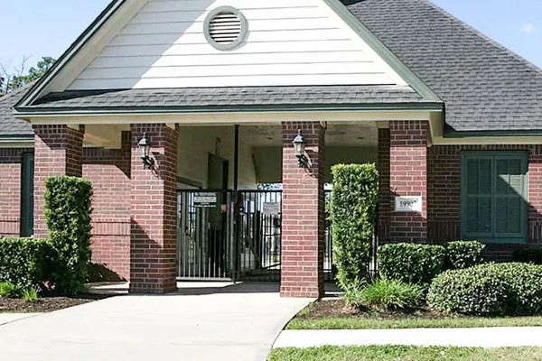 a view of a house with swimming pool and sitting area