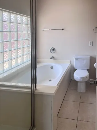 a bathroom with a sink a toilet and bathtub